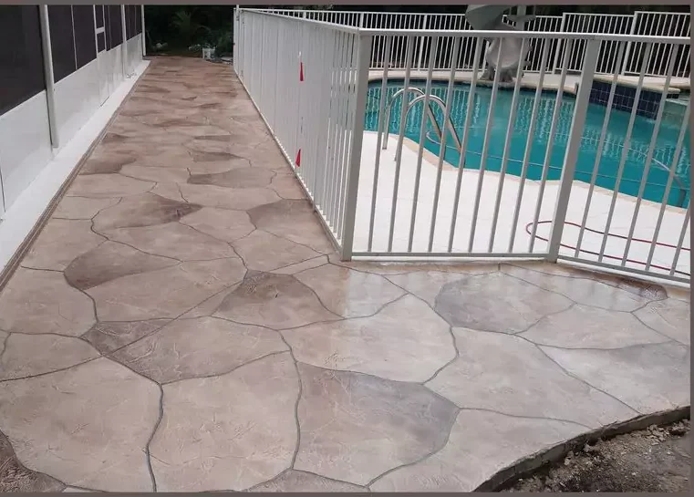 concrete contractor resurfacing a pool deck with a eurotile stamped lookin Reno NV